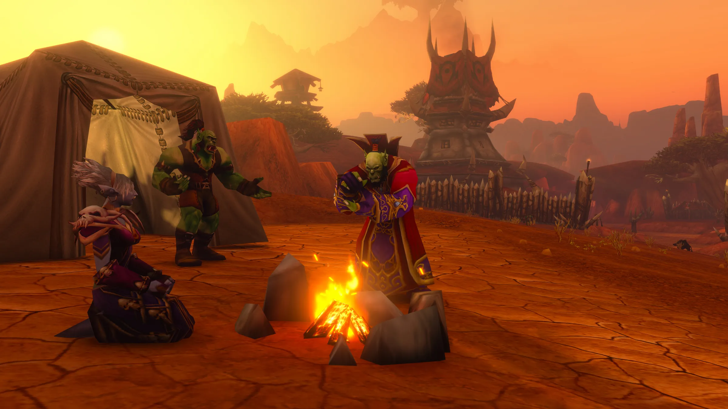 Horde players resting around a campfire at dusk