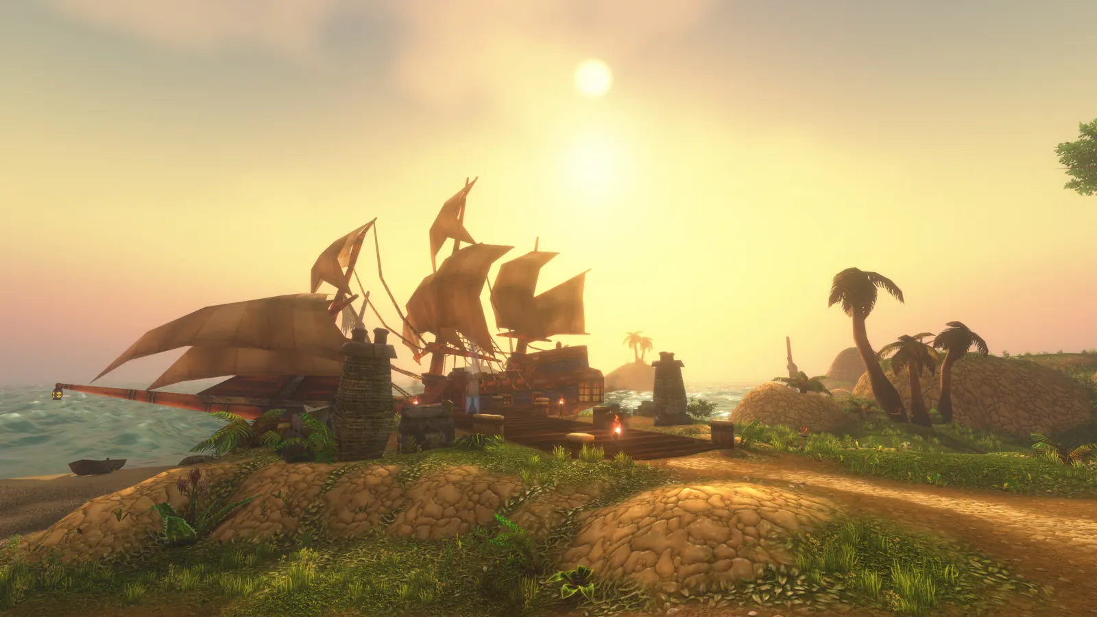 Sailing ships moored off a grassy island with palm trees