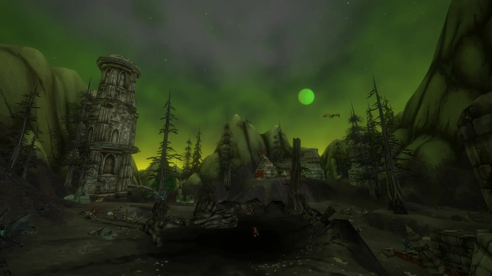 A ruined stone tower under a green, fel-lit sky