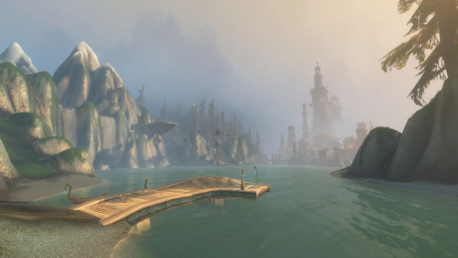 A wooden dock on a lake, with cliffs and a pale tower in the haze